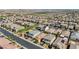 An aerial view showcases a Primary-planned community with neat rows of houses, many featuring solar panels on their roofs at 2940 Duverney Ave, Henderson, NV 89044