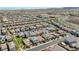 A scenic aerial view showcases a thriving neighborhood with orderly streets and diverse housing options against a desert backdrop at 2940 Duverney Ave, Henderson, NV 89044