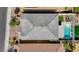 Aerial shot shows the layout of the home, including a pool, patio area, and adjacent landscaped green spaces at 2940 Duverney Ave, Henderson, NV 89044