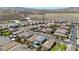 Wide aerial view of a neighborhood featuring well-maintained homes and desert landscape at 2940 Duverney Ave, Henderson, NV 89044