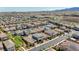 An aerial view of a vibrant residential neighborhood with well-maintained homes and landscaping in a desert environment at 2940 Duverney Ave, Henderson, NV 89044