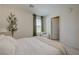 Serene bedroom featuring soft lighting, a decorative plant, and a cozy reading corner at 2940 Duverney Ave, Henderson, NV 89044