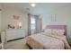 bedroom featuring pink themed bed, dresser and decor with natural lighting at 2940 Duverney Ave, Henderson, NV 89044