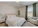 Cozy bedroom featuring an inviting bed, stylish side table, and complementary decor at 2940 Duverney Ave, Henderson, NV 89044