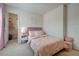 bedroom featuring pink themed bed, and decor with view into walk-in closet at 2940 Duverney Ave, Henderson, NV 89044