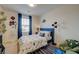 bedroom featuring dinosaur themed bed and decor with blue curtains at 2940 Duverney Ave, Henderson, NV 89044