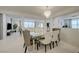Bright dining room featuring modern chandelier, stylish chairs, and an elegant mirrored table at 2940 Duverney Ave, Henderson, NV 89044