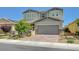 Charming two-story home featuring a manicured front yard and a spacious two-car garage at 2940 Duverney Ave, Henderson, NV 89044
