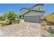 Charming two-story home featuring a manicured front yard and a spacious two-car garage at 2940 Duverney Ave, Henderson, NV 89044