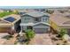 Charming two-story home with a well-manicured front yard and a two-car garage at 2940 Duverney Ave, Henderson, NV 89044
