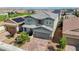 Charming two-story home with a well-manicured front yard and a two-car garage at 2940 Duverney Ave, Henderson, NV 89044