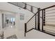 Bright foyer with sleek tile flooring, modern staircase, and an open floor plan at 2940 Duverney Ave, Henderson, NV 89044