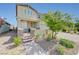 Well-manicured front yard with mature trees and a brick pathway leading to the entrance at 2940 Duverney Ave, Henderson, NV 89044