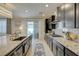 Gourmet kitchen with stainless steel appliances, granite countertops, and a large island with seating at 2940 Duverney Ave, Henderson, NV 89044