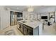 Open-concept kitchen featuring a large island that flows into the living room at 2940 Duverney Ave, Henderson, NV 89044