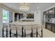 Open-concept kitchen featuring a large island with seating and modern appliances at 2940 Duverney Ave, Henderson, NV 89044