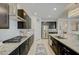 Modern kitchen with granite countertops, a stainless steel refrigerator, and ample counter space at 2940 Duverney Ave, Henderson, NV 89044