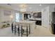 Modern kitchen with granite countertops, stainless steel appliances, and a large central island at 2940 Duverney Ave, Henderson, NV 89044