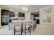 Well-lit kitchen with a large island, stainless steel appliances, and ample cabinet space at 2940 Duverney Ave, Henderson, NV 89044