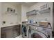 A bright and functional laundry room with modern washer, dryer, and storage solutions at 2940 Duverney Ave, Henderson, NV 89044