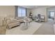 Comfortable and stylish living room with lots of natural light with access to playroom at 2940 Duverney Ave, Henderson, NV 89044