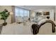 Open living space with floor-to-ceiling windows, plush seating, and an open-concept design at 2940 Duverney Ave, Henderson, NV 89044