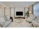 Inviting living room featuring neutral tones, modern decor, and lots of natural light at 2940 Duverney Ave, Henderson, NV 89044