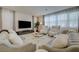 Inviting living room showcasing plush sofas, large windows, and stylish decor at 2940 Duverney Ave, Henderson, NV 89044