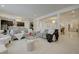 Spacious living area with modern decor, plush seating, and easy access to the kitchen and dining spaces at 2940 Duverney Ave, Henderson, NV 89044