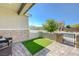 Cozy front patio with a small patch of green turf, perfect for outdoor seating and relaxation at 2940 Duverney Ave, Henderson, NV 89044