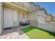 Cozy front patio with a small patch of green turf, perfect for outdoor seating and relaxation at 2940 Duverney Ave, Henderson, NV 89044