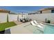 Inviting backyard showcases a sparkling pool, stylish lounge chairs, and a cozy patio area for outdoor enjoyment at 2940 Duverney Ave, Henderson, NV 89044