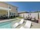 Beautiful backyard with a shimmering pool, sunken lounge chairs, and inviting patio space for outdoor living at 2940 Duverney Ave, Henderson, NV 89044
