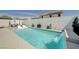 Gorgeous backyard with a stunning pool and elegant waterfall feature, perfect for relaxation and entertainment at 2940 Duverney Ave, Henderson, NV 89044