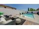 Private backyard includes a sparkling pool, modern patio furniture, and a stylish outdoor entertaining area at 2940 Duverney Ave, Henderson, NV 89044