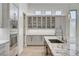Modern kitchen with stainless steel appliances, granite countertops, and custom cabinets at 33 Hassayampa Trl, Henderson, NV 89052