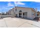 Spacious backyard with a large concrete patio area under a blue sky at 3544 Mountain Valley Dr, Las Vegas, NV 89129