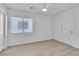 Bright bedroom with light-colored wood floors, ceiling fan, and natural light from the window at 3544 Mountain Valley Dr, Las Vegas, NV 89129