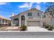 Charming two-story home with a two-car garage and landscaped front yard at 3544 Mountain Valley Dr, Las Vegas, NV 89129