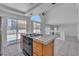 Bright kitchen features an island cooktop, stainless appliances, and access to the living area at 3544 Mountain Valley Dr, Las Vegas, NV 89129