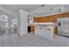 Kitchen featuring an island, stainless steel appliances, and tile flooring at 3544 Mountain Valley Dr, Las Vegas, NV 89129