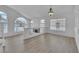 Open-concept living area with fireplace, large windows, and stylish lighting at 3544 Mountain Valley Dr, Las Vegas, NV 89129