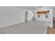 Spacious living room featuring tiled flooring and seamless transition into the kitchen at 3544 Mountain Valley Dr, Las Vegas, NV 89129