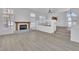 Spacious living room with fireplace, wood floors, and ample natural light at 3544 Mountain Valley Dr, Las Vegas, NV 89129