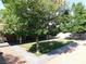 Large backyard with manicured lawn, patio, covered patio and mature landscaping for outdoor living at 391 Newbury Ct, Henderson, NV 89015