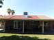 Spacious covered patio overlooking the backyard, great for outdoor dining or relaxation with mature trees at 391 Newbury Ct, Henderson, NV 89015