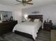 Well-lit bedroom with hard wood floors, and large dresser at 391 Newbury Ct, Henderson, NV 89015