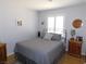 Cozy bedroom with hardwood floors and a window with white shutters at 391 Newbury Ct, Henderson, NV 89015