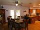 Inviting dining area featuring a kitchen bar and wood flooring at 391 Newbury Ct, Henderson, NV 89015