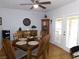 Charming dining room featuring wood flooring, a ceiling fan, and a buffet cabinet at 391 Newbury Ct, Henderson, NV 89015